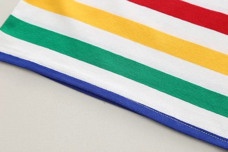 Front view of a kids' striped overalls and white t-shirt summer outfit on a hanger.