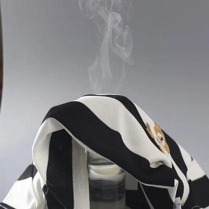 Front view of a folded kids' striped t-shirt and matching shorts set for toddlers, playground clothes.