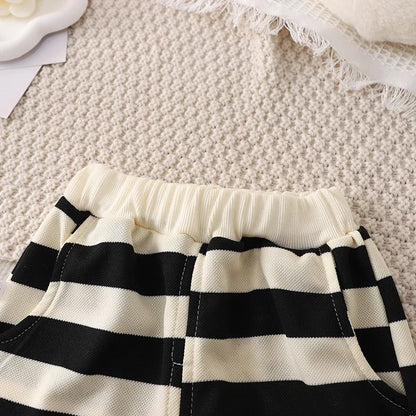 Flat lay of a cheerful yellow & white striped t-shirt with coordinating shorts for toddlers, comfy outfit.