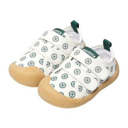 Toddler in blue breathable canvas sneakers, perfect for active play and summer outings.