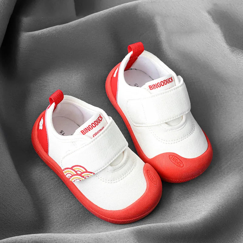 Assortment of vibrant canvas shoes for kids, all with breathable material and secure fastenings.