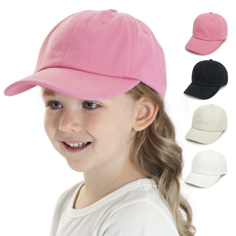 Toddler in blue cotton baseball cap, front view, for sun protection outdoor play