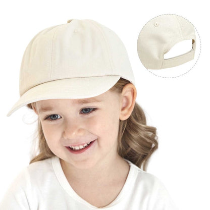 Infant wearing a pink cotton baseball cap, back view, adjustable for a snug fit