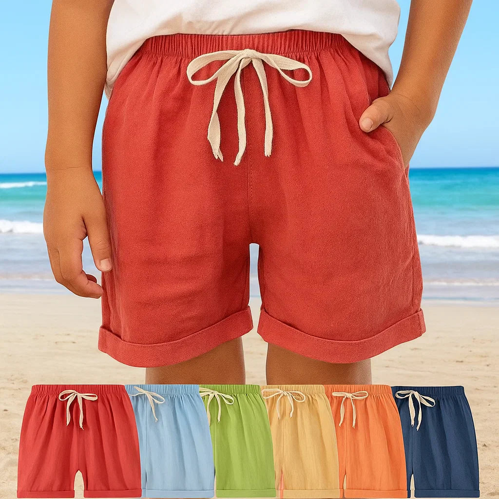Toddler in blue cotton-linen play shorts, perfect for summer comfort and breathability.