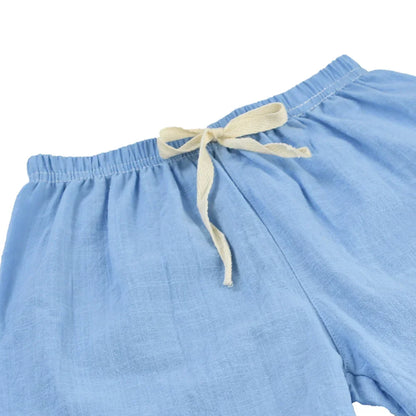 Kids' red cotton-linen shorts with elastic waist, ideal for active summer play.