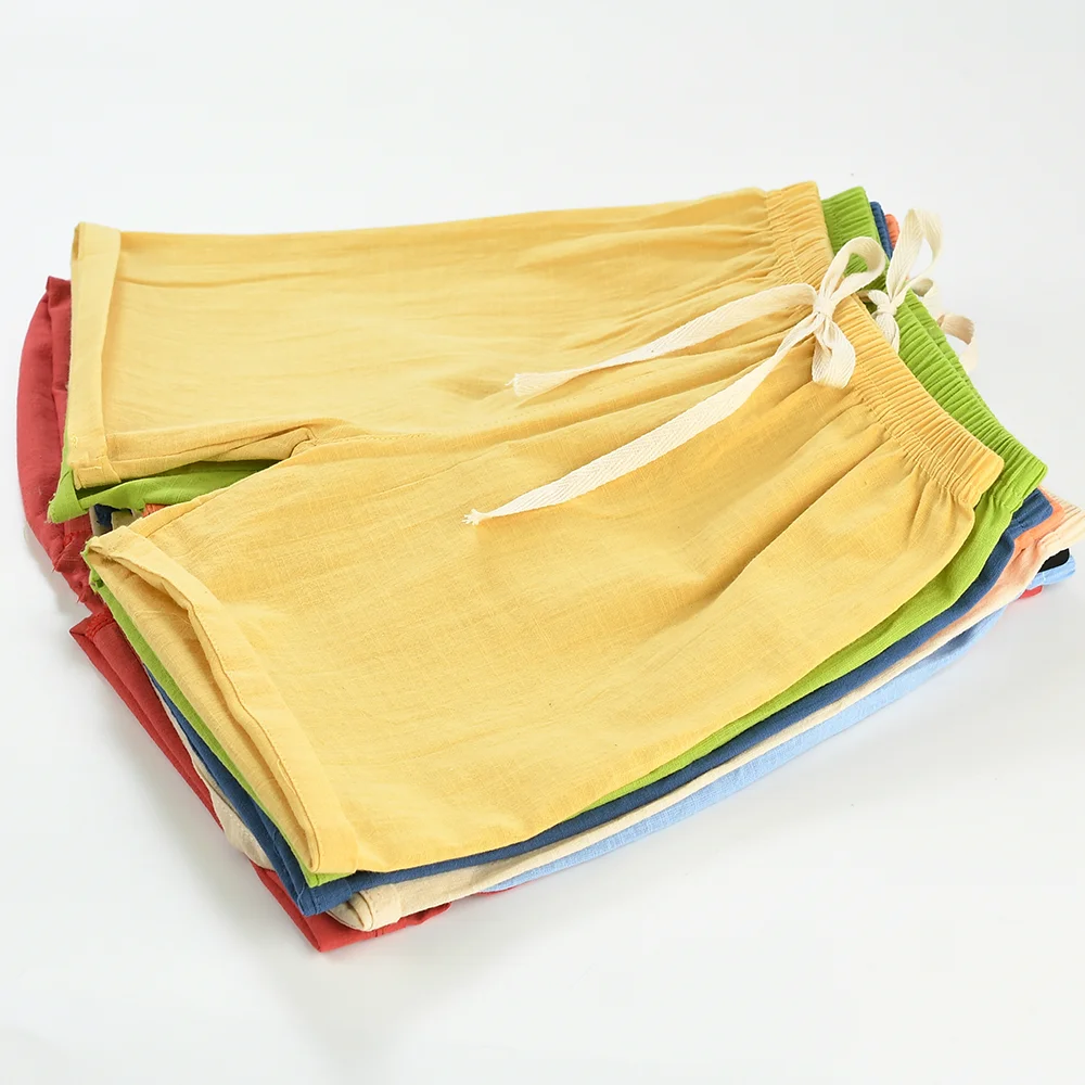 Green breathable cotton-linen shorts for children, designed for ultimate summer comfort.