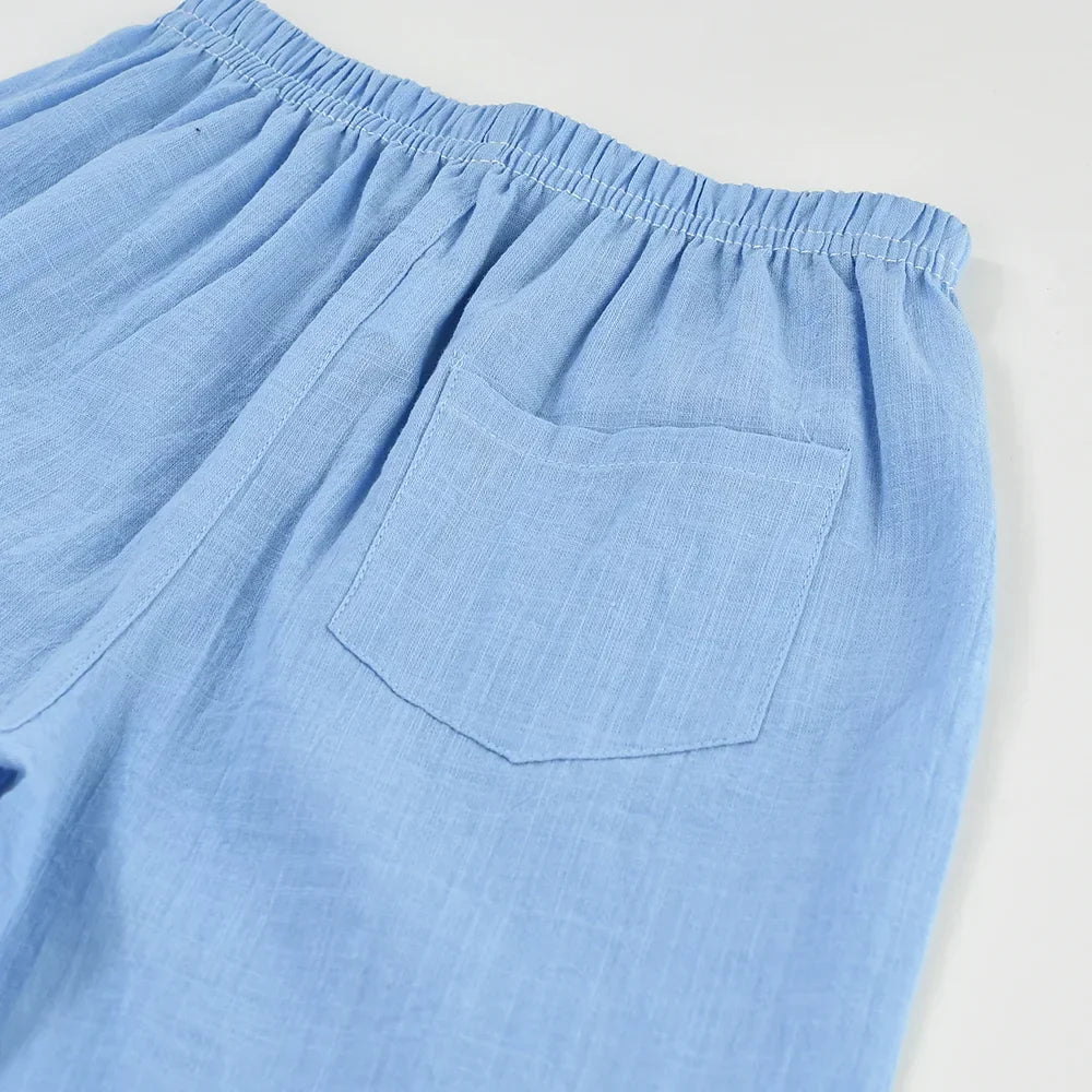 Yellow cotton-linen shorts for kids, featuring an elastic waistband for easy summer wear.