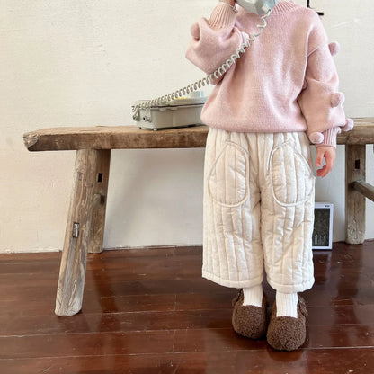 Unisex baby cotton harem pants, showcasing the relaxed fit and soft material.