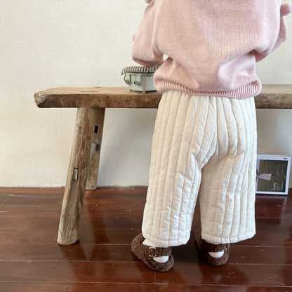 Stylish baby outfit featuring cotton harem pants and a coordinating top for casual days.
