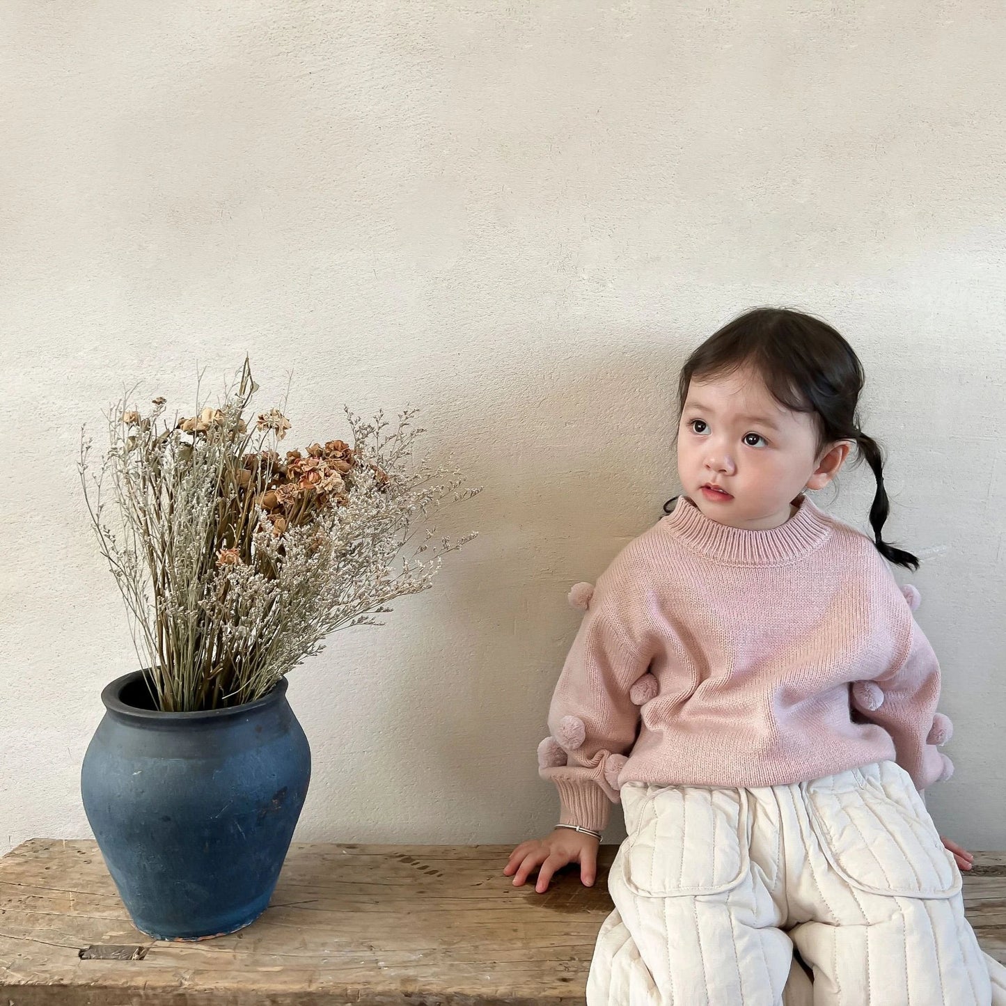 Kids' fashion: an arrangement of cotton harem pants, highlighting their versatility and comfort.