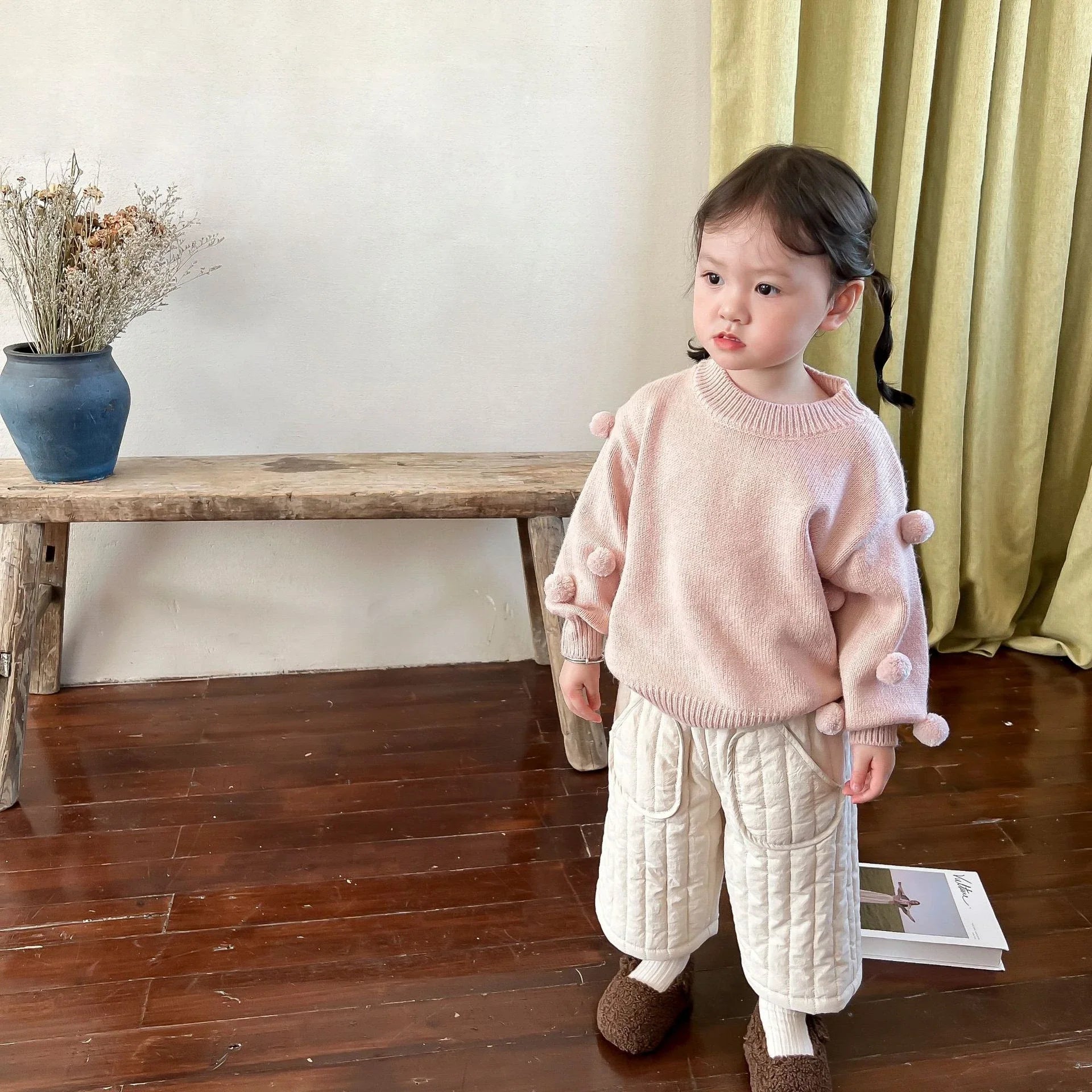 Elastic waist cotton harem pants for babies, emphasizing the easy-to-wear design.