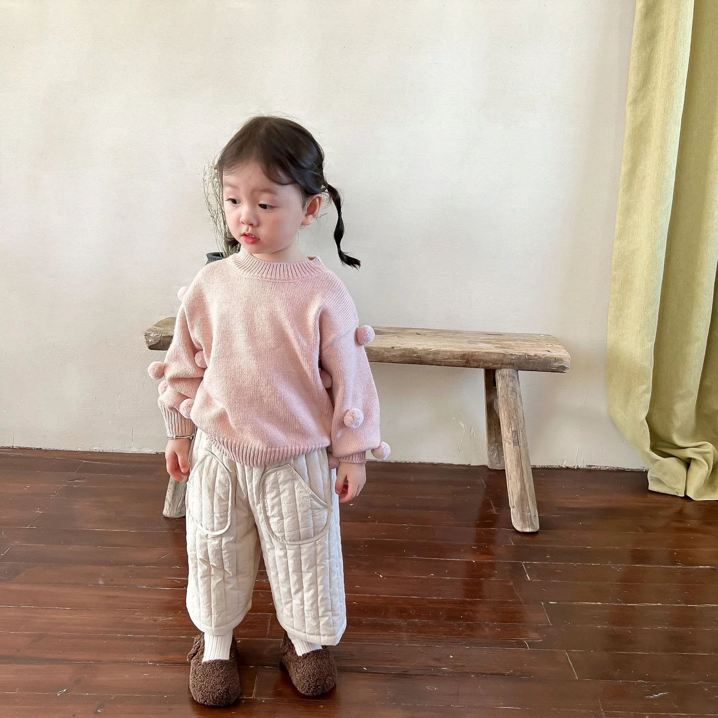 A child crawling comfortably in spacious cotton harem pants, perfect for active kids.