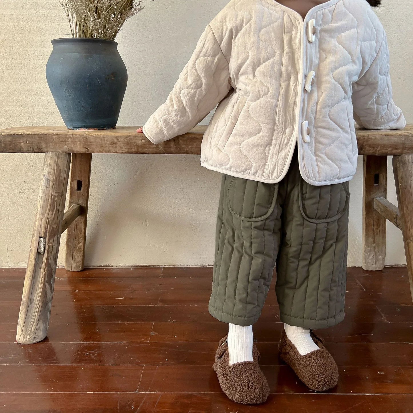 Back view of elastic waist cotton harem pants on a child, revealing the comfortable fit.