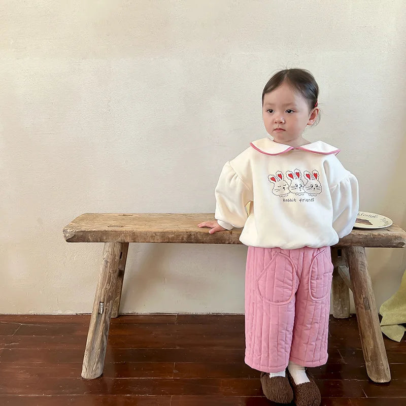 Unisex kids' cotton harem pants with an elastic waist, ideal for casual baby clothing.