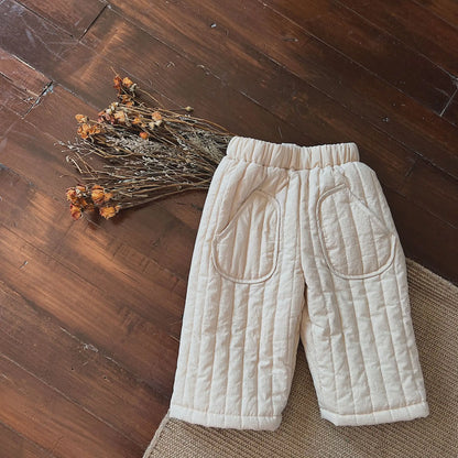 A stack of colorful kids' elastic waist cotton harem pants, showing various color options.
