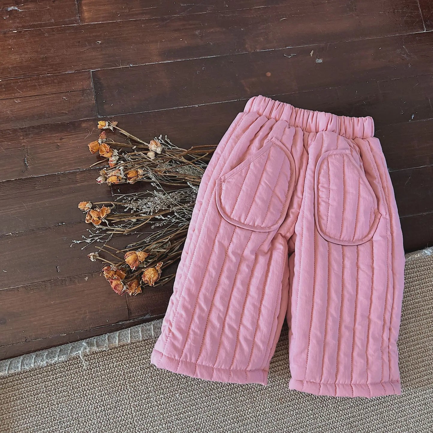 Detail shot of the breathable cotton fabric of children's harem pants, great for active toddlers.