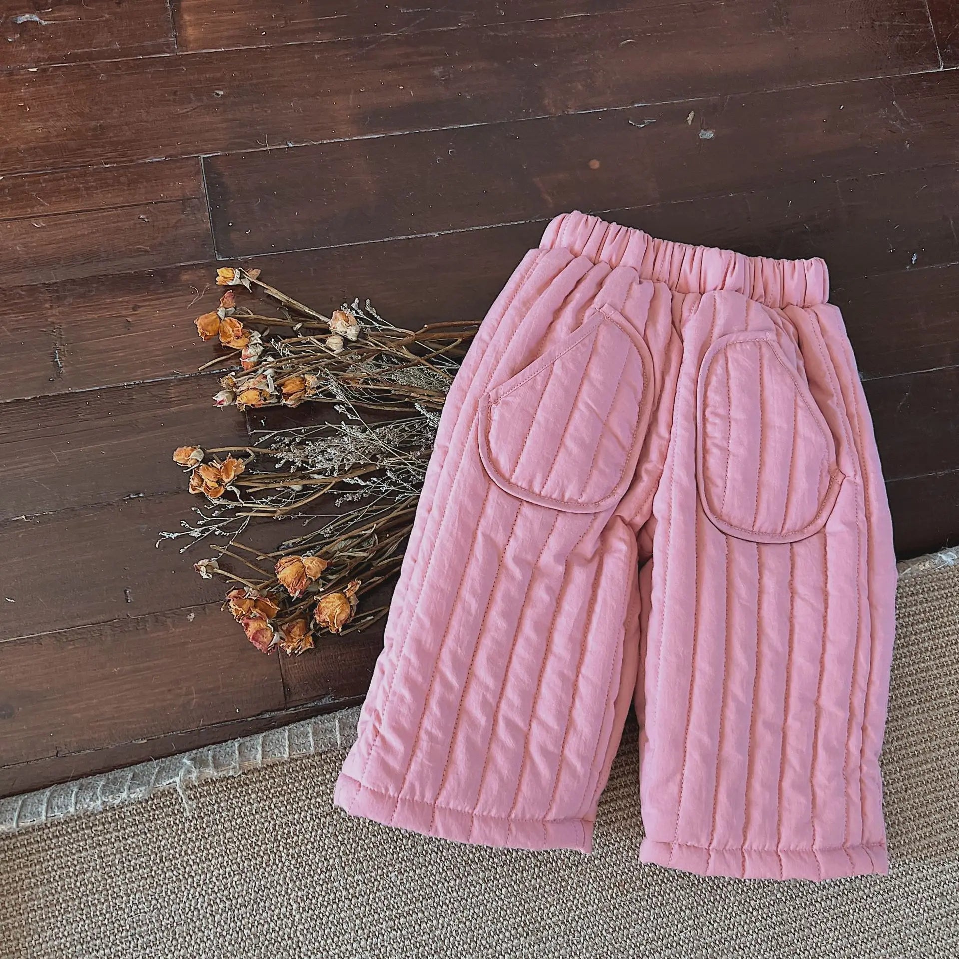 Detail shot of the breathable cotton fabric of children's harem pants, great for active toddlers.