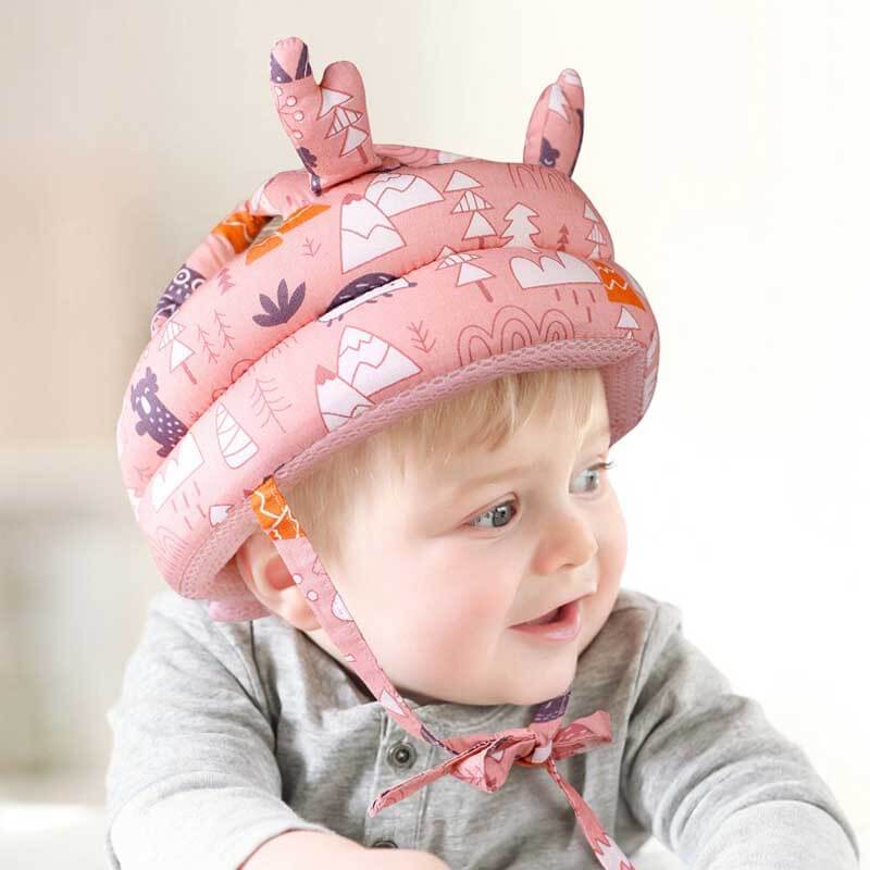 Toddler in soft cotton safety headguard hat, adjustable for anti-fall protection while learning to walk