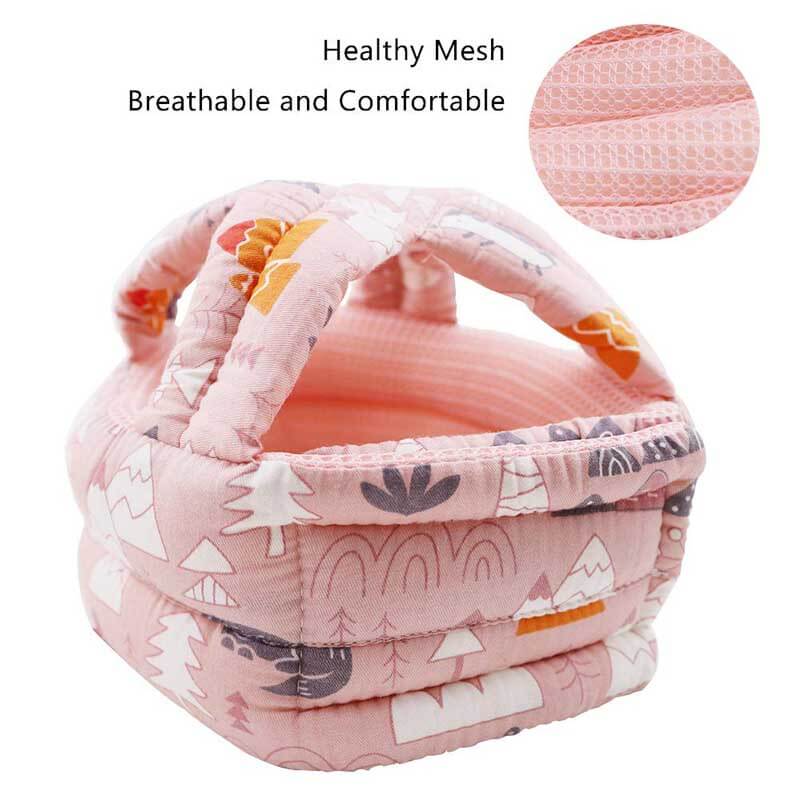 Baby wearing a soft headguard helmet, designed for head protection during early walking and playtime