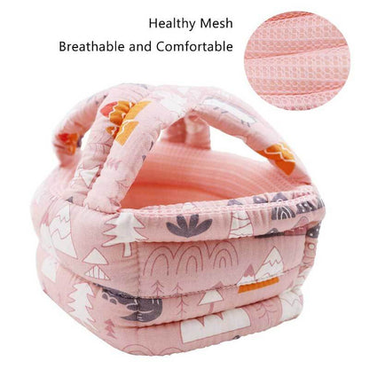 Baby wearing a soft headguard helmet, designed for head protection during early walking and playtime