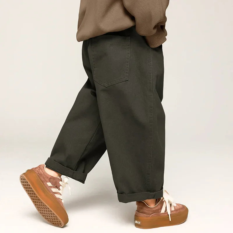 Close-up of elastic waist on blue wide leg cotton pants for toddlers, comfortable unisex design