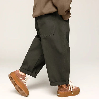 Close-up of elastic waist on blue wide leg cotton pants for toddlers, comfortable unisex design