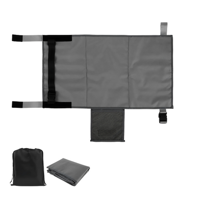 Gray toddler airplane bed, deflated, with carrying bag, a practical portable bed for flight comfort.