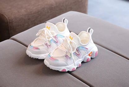 Close-up of the breathable textile on toddler kids athletic sneakers, showcasing quality & ventilation