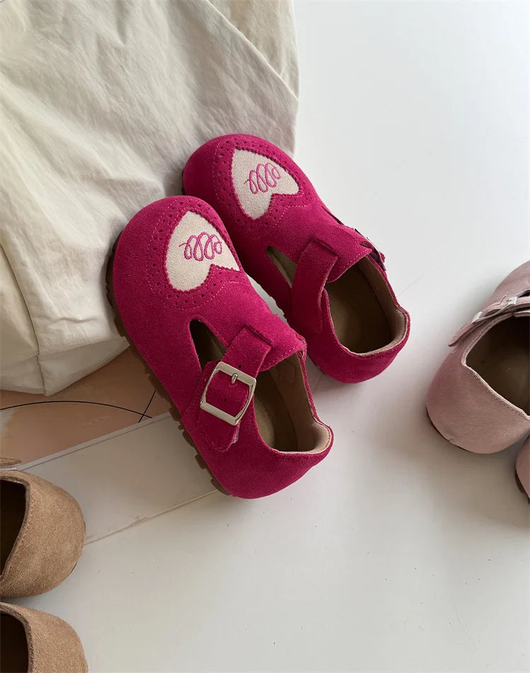 Assortment of colorful children's leather barefoot shoes, all with flexible soft soles.