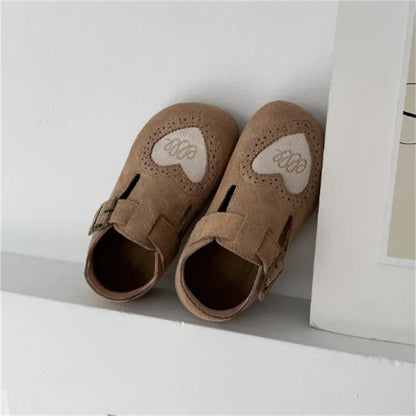 Close-up of children's leather barefoot shoe sole, highlighting its soft, flexible design.