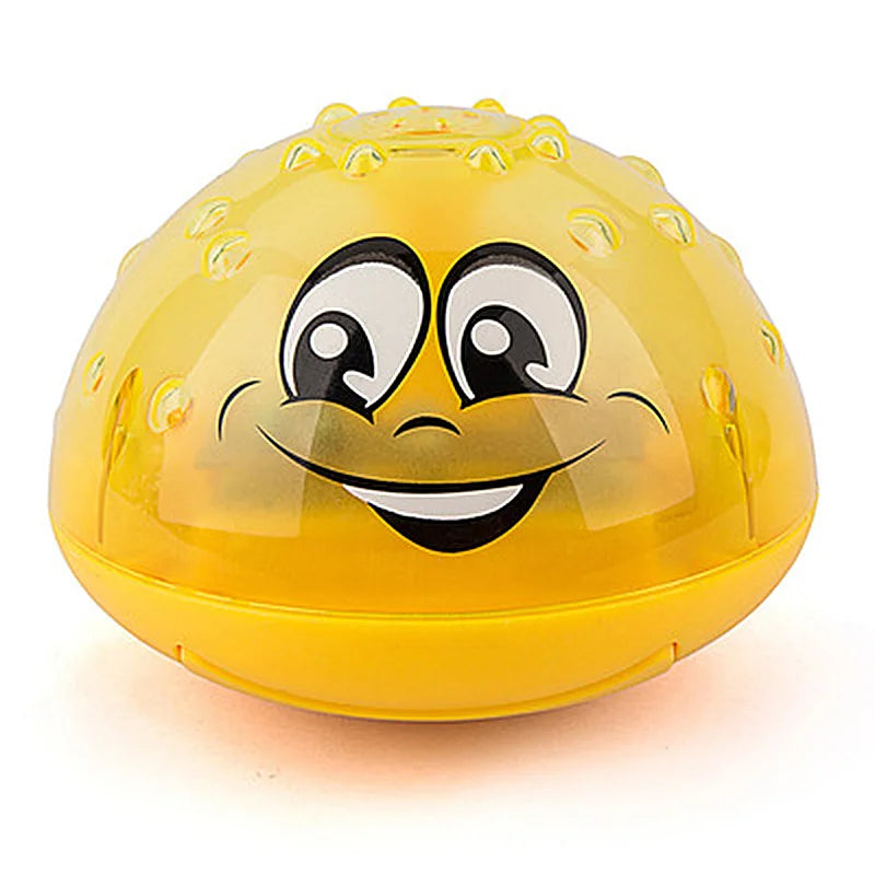 Smiling child playing with an LED light-up water spray bath toy, creating a joyful bath experience.