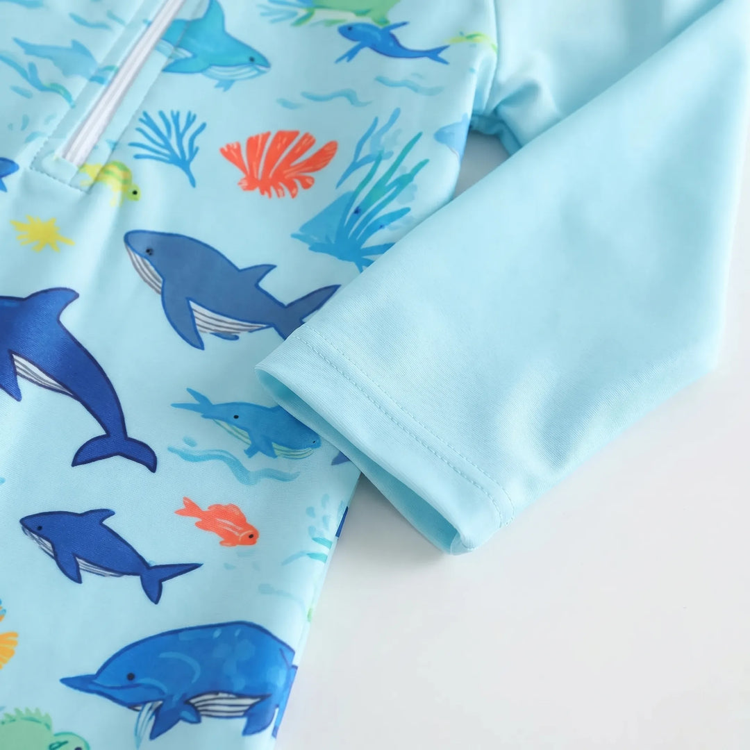 Adorable marine animal print toddler long-sleeve swim romper and matching hat for sun protection.