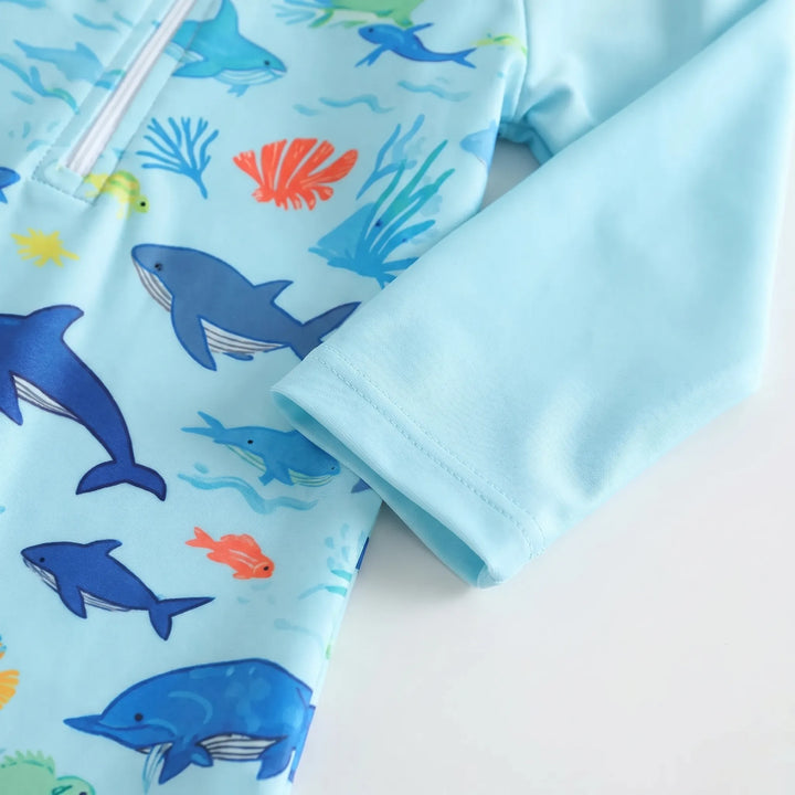 Adorable marine animal print toddler long-sleeve swim romper and matching hat for sun protection.