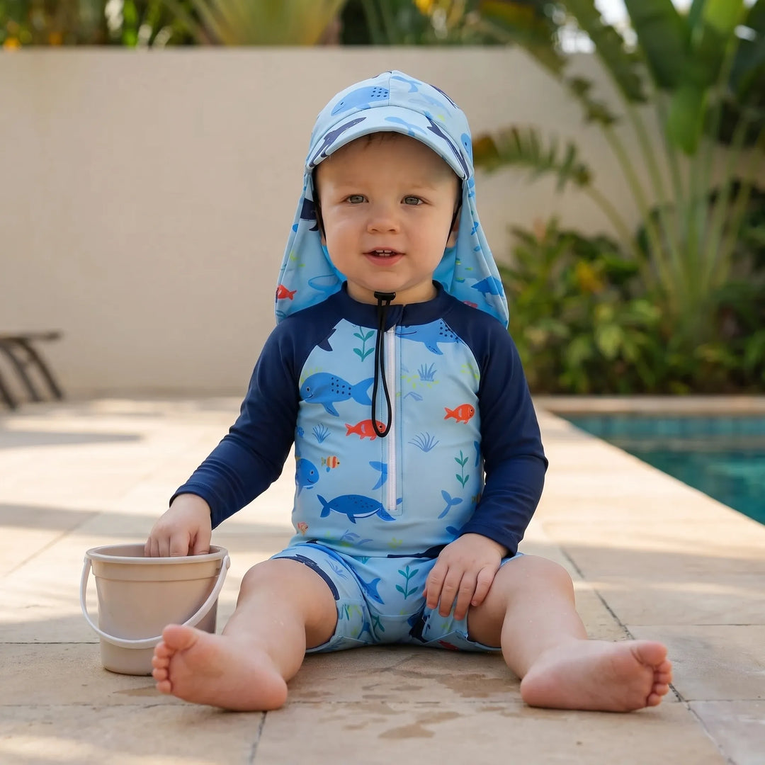 Boys/girls toddler long-sleeve swim romper & hat set. UPF 50+ swimwear, ideal for summer play & beach.