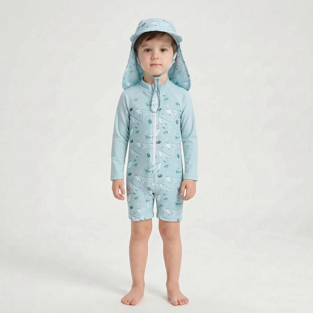 Child's long-sleeve UPF 50+ sun protective swimsuit & hat, ideal for water play & beach exploration.