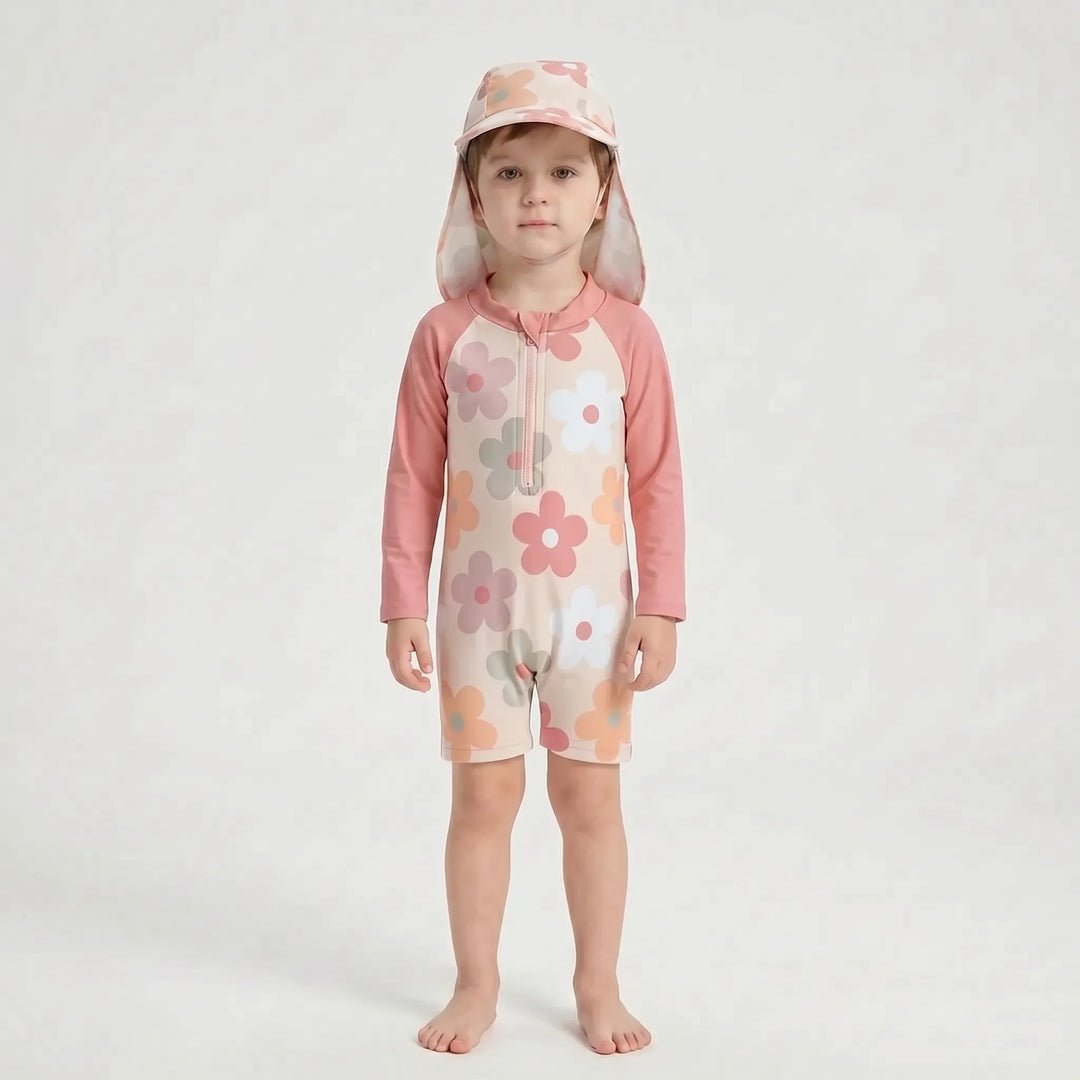 Easy-changing long-sleeve toddler swimsuit with full sun protection and coordinating swim hat.