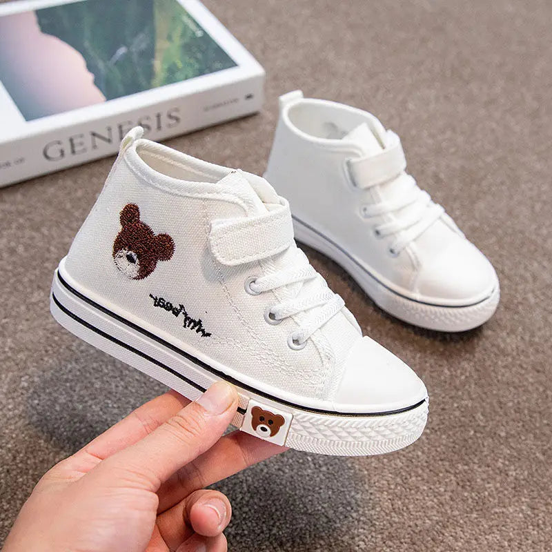 Children's durable grey mesh sneakers featuring a secure velcro closure and non-slip sole.