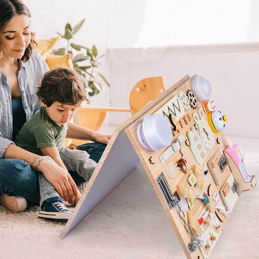 Toddler Montessori wooden activity board for fine motor skills development, featuring latches and gears.