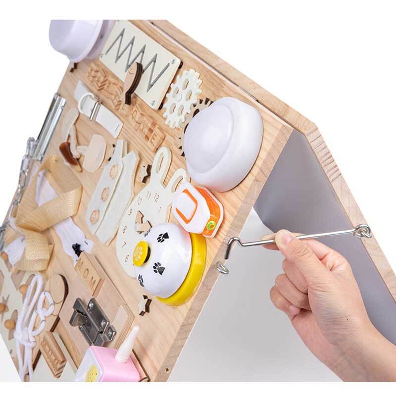 Educational wooden activity board for toddlers, showcasing locks, buckles, and a spinning wheel.