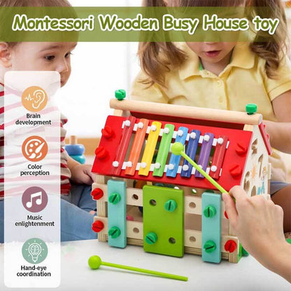 Close-up of a toddler's hand interacting with the fine motor skill components of a Montessori Wooden Activity House.