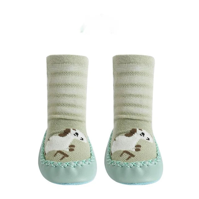 Close-up of the non-slip sole on a toddler animal sock, safe footwear for baby