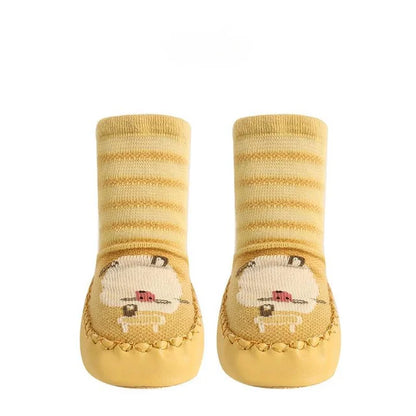 Toddler non-slip socks in a bright yellow with a cute lion print, soft baby footwear
