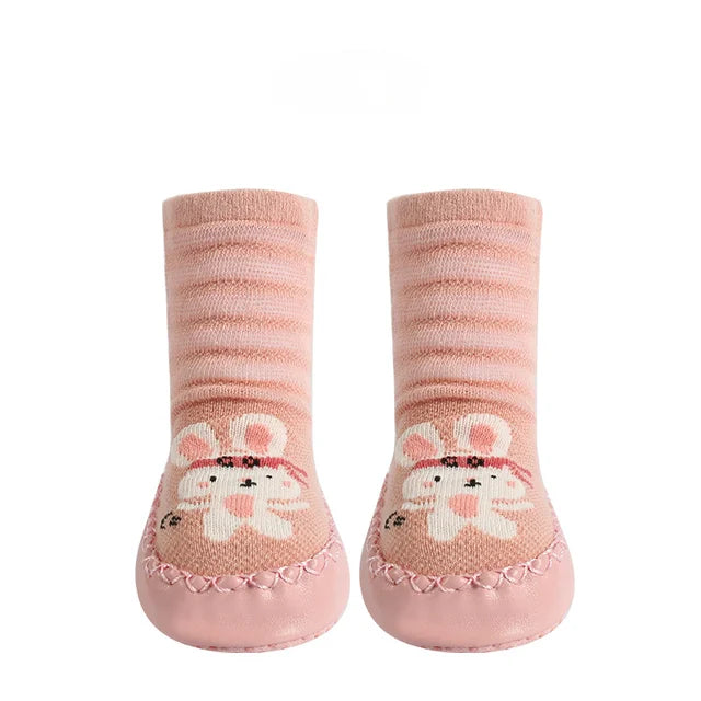 Three pairs of toddler non-slip socks with various animal prints, essential baby footwear