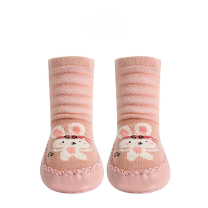 Three pairs of toddler non-slip socks with various animal prints, essential baby footwear