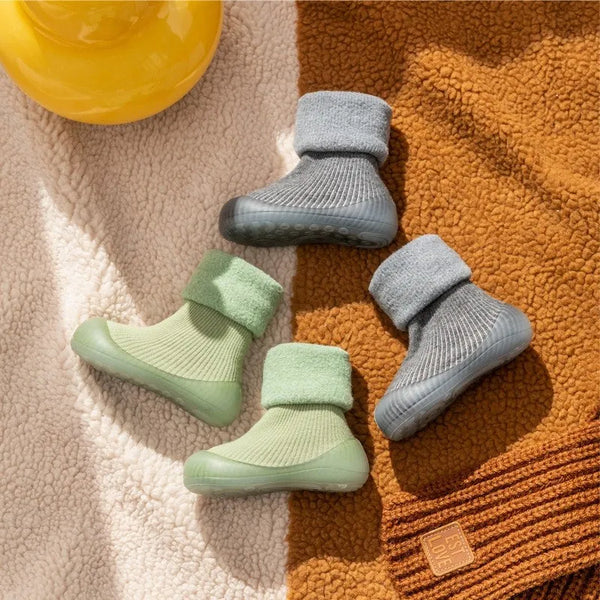 Close-up of non-slip sole on toddler sock shoes for infant first steps