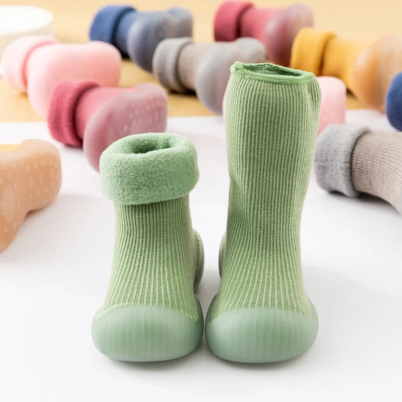 Pair of colorful grip sock shoes for toddlers, ideal soft sole footwear
