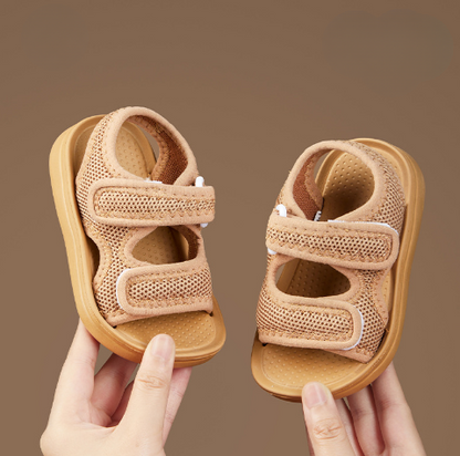 Close-up of kids' summer sandals showing soft sole and supportive arch for comfortable outdoor wear