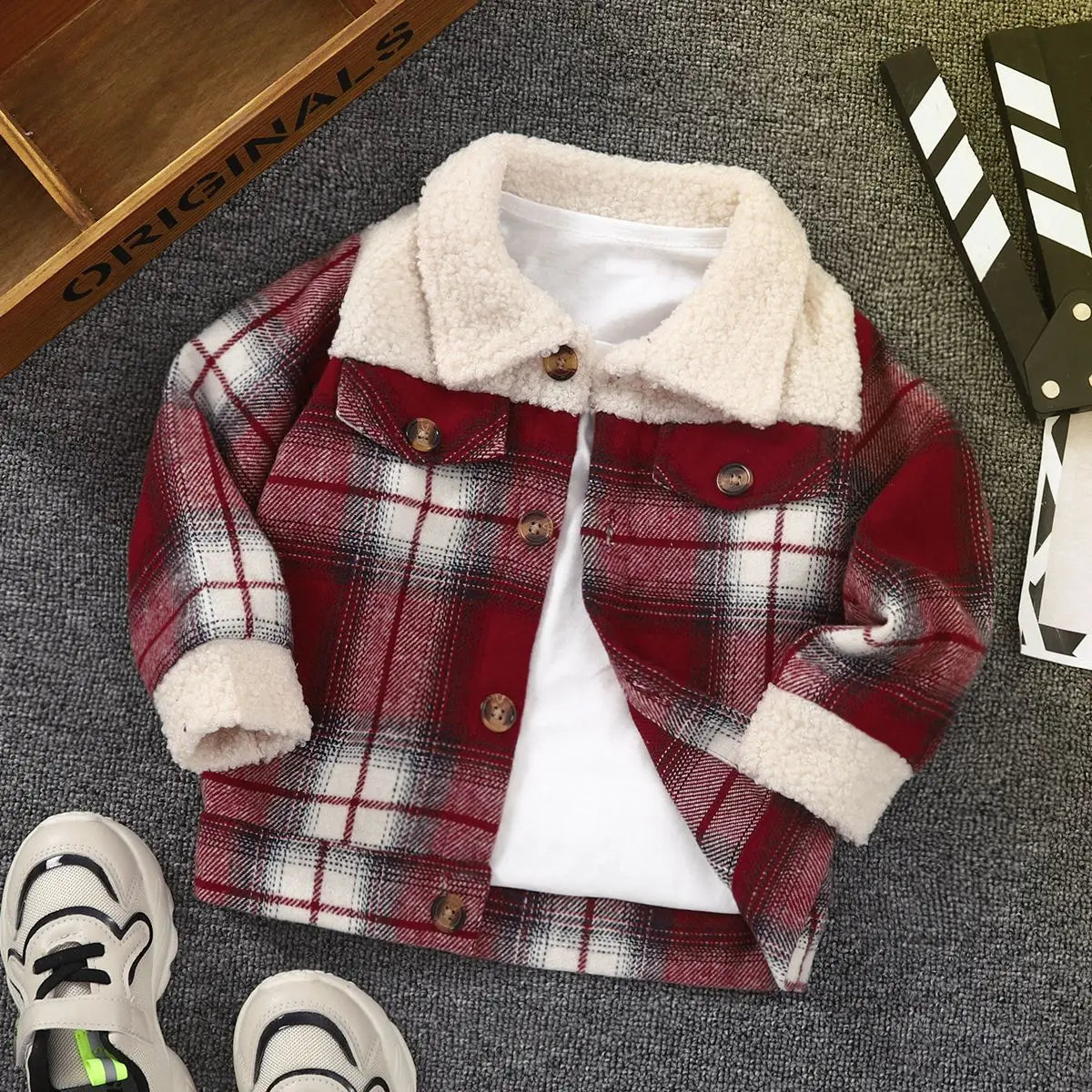 Kids' warm plaid jacket for toddlers, featuring a classic checkered design and insulation