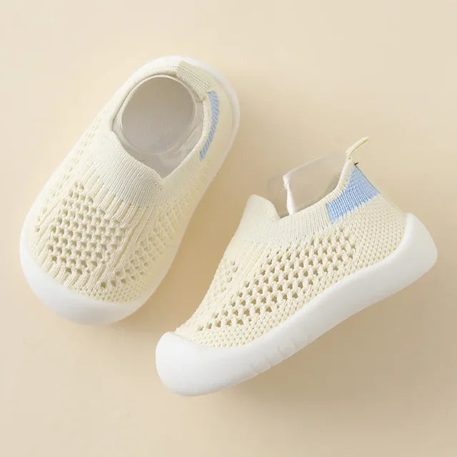 Boy running in durable soft sole non-slip play shoes outdoors