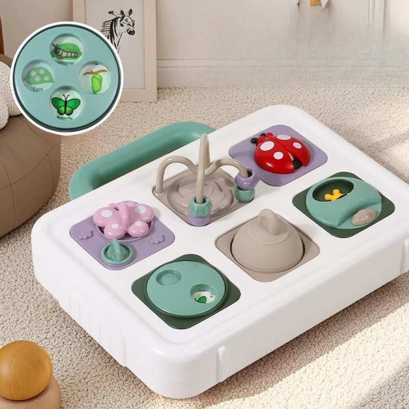 Toddler playing with a colorful sensory activity busy board, developing fine motor skills and hand-eye coordination.